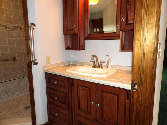 full bathroom with vanity and a shower stall