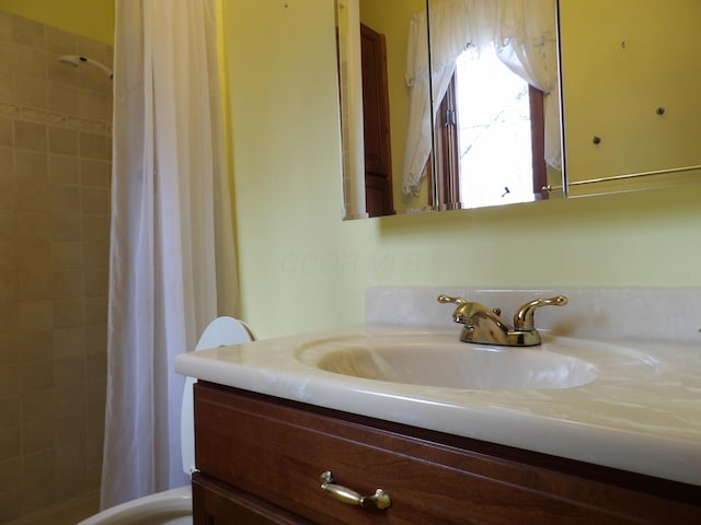 full bathroom featuring vanity and curtained shower