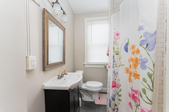 bathroom with baseboards, curtained shower, toilet, vanity, and tile patterned flooring