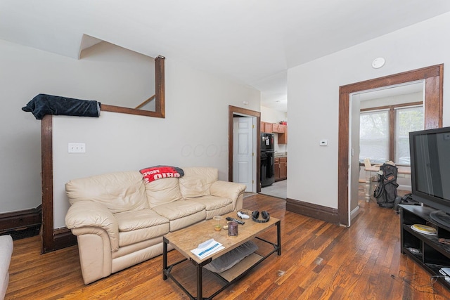 living room with baseboards and hardwood / wood-style floors