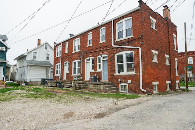 multi unit property with cooling unit and brick siding