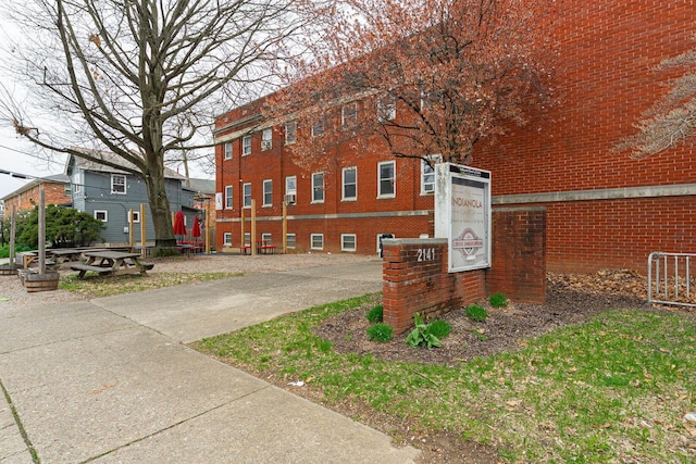 view of property exterior featuring brick siding