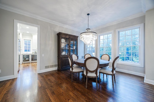 6920 Clivdon Mews, New Albany, OH 43054 - dining space with baseboards, ornamental molding, a chandelier, visible vents, and dark wood finished floors