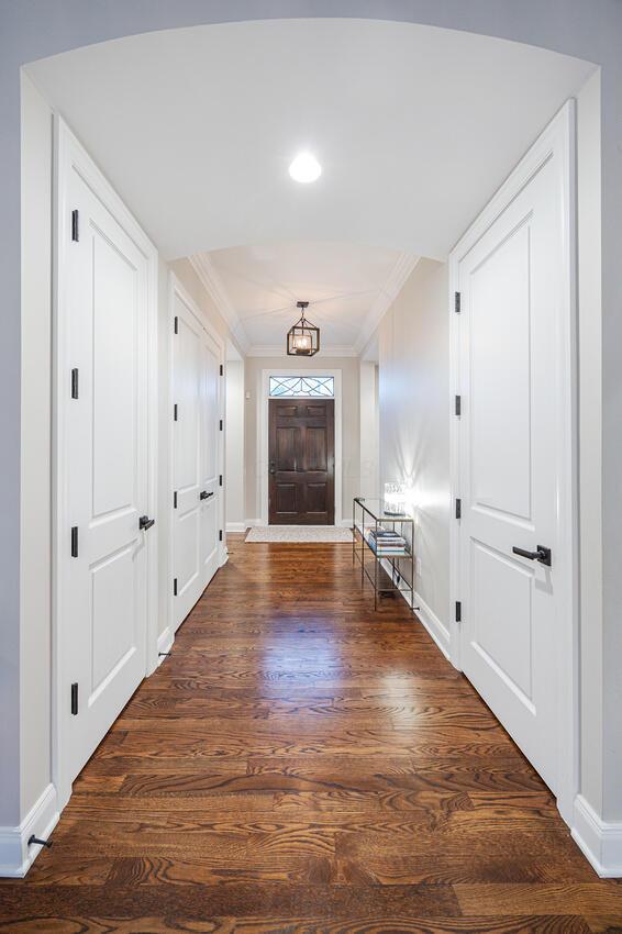 6920 Clivdon Mews, New Albany, OH 43054 - corridor with crown molding, dark wood-style flooring, and baseboards