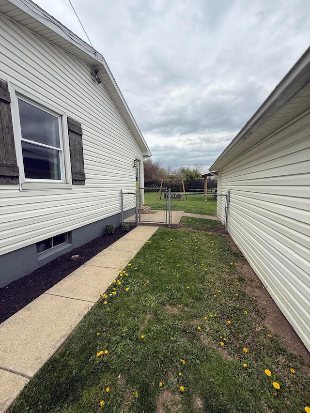 view of yard featuring a gate and fence