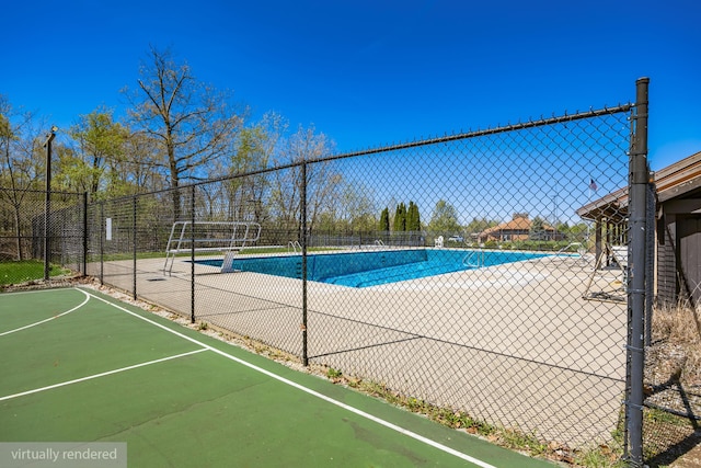 community pool featuring fence
