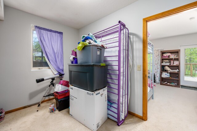 carpeted bedroom with baseboards