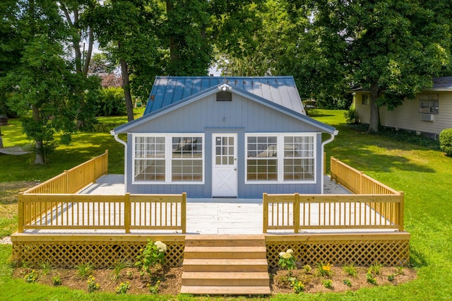 13384 Orchard Is NE, Millersport, OH 43046 - rear view of property featuring a lawn, a wooden deck, a standing seam roof, and metal roof