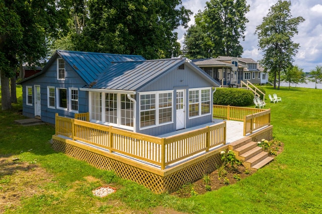13384 Orchard Is NE, Millersport, OH 43046 - back of house featuring a standing seam roof, metal roof, a yard, and a deck