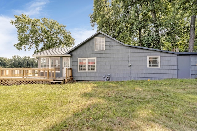 13384 Orchard Is NE, Millersport, OH 43046 - rear view of house with a wooden deck, a standing seam roof, a lawn, and metal roof