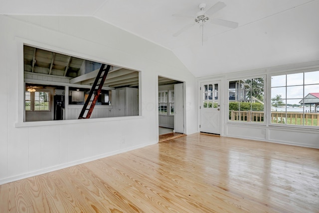 13384 Orchard Is NE, Millersport, OH 43046 - unfurnished living room featuring lofted ceiling, plenty of natural light, wood finished floors, and ceiling fan