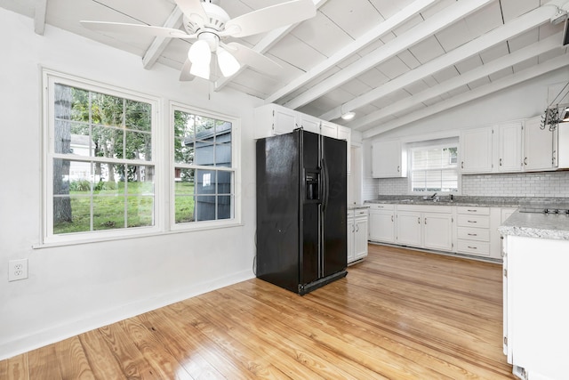 13384 Orchard Is NE, Millersport, OH 43046 - kitchen featuring black fridge, white cabinets, tasteful backsplash, and baseboards