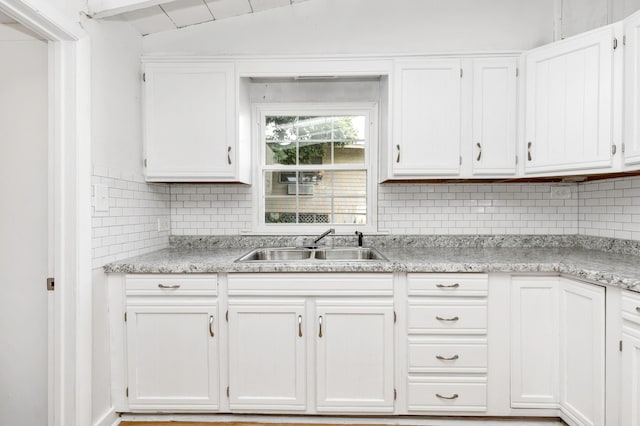 13384 Orchard Is NE, Millersport, OH 43046 - kitchen with a sink, white cabinets, backsplash, and vaulted ceiling