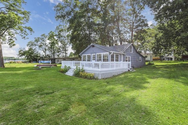 13384 Orchard Is NE, Millersport, OH 43046 - back of property with a yard, a wooden deck, and a metal roof