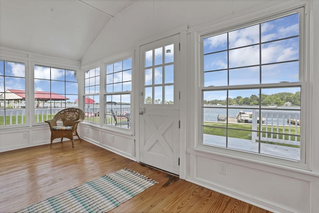 13384 Orchard Is NE, Millersport, OH 43046 - sunroom / solarium featuring lofted ceiling, wood finished floors, a water view, and a decorative wall