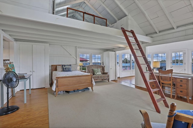 13384 Orchard Is NE, Millersport, OH 43046 - bedroom with high vaulted ceiling, wood finished floors, and access to outside