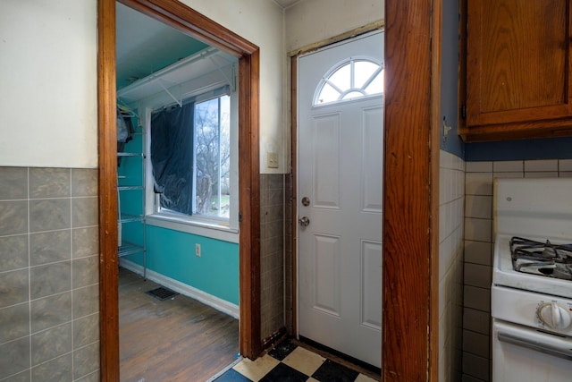 751 Bobo Rd, Beaver, OH 45613 - entrance foyer with tile patterned floors, tile walls, and visible vents