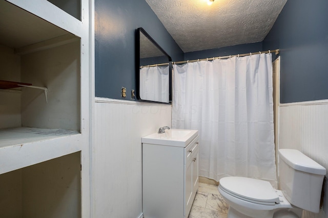 751 Bobo Rd, Beaver, OH 45613 - full bathroom with toilet, a textured ceiling, vanity, wainscoting, and marble finish floor