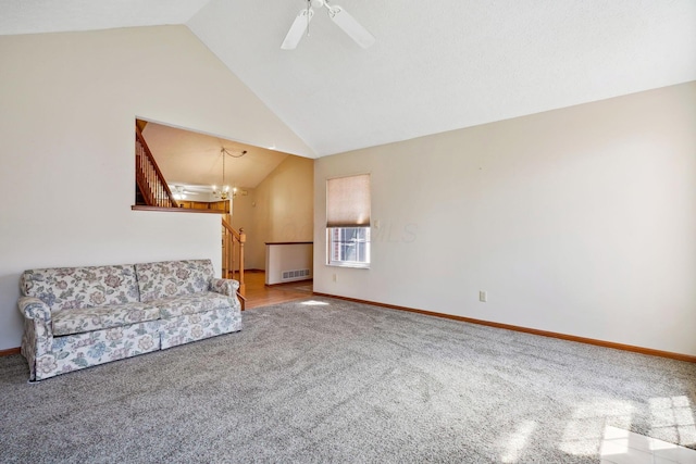 5955 Glen Village Dr, Dublin, OH 43016 - unfurnished living room featuring baseboards, ceiling fan with notable chandelier, vaulted ceiling, and carpet floors