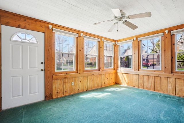 5955 Glen Village Dr, Dublin, OH 43016 - unfurnished sunroom featuring wood walls and carpet