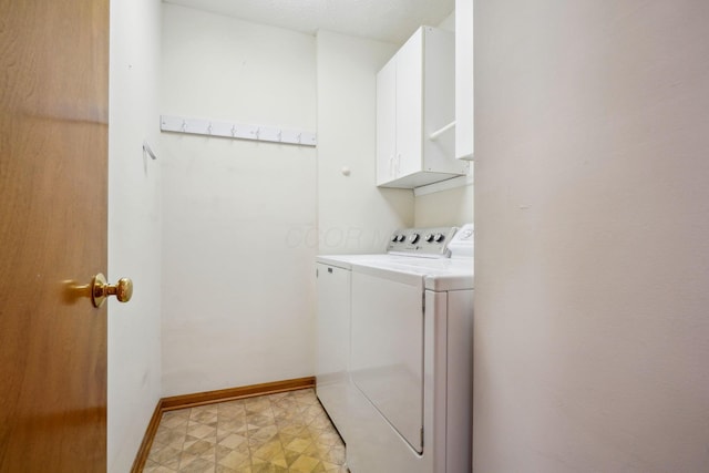 5955 Glen Village Dr, Dublin, OH 43016 - laundry room featuring baseboards, washing machine and clothes dryer, light floors, and cabinet space