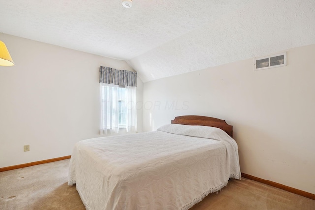 5955 Glen Village Dr, Dublin, OH 43016 - bedroom featuring visible vents, baseboards, carpet flooring, and a textured ceiling