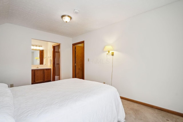 5955 Glen Village Dr, Dublin, OH 43016 - bedroom with ensuite bath, light colored carpet, baseboards, and a textured ceiling