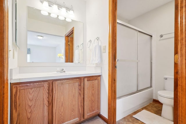 5955 Glen Village Dr, Dublin, OH 43016 - full bathroom featuring shower / bath combination with glass door, vanity, and toilet