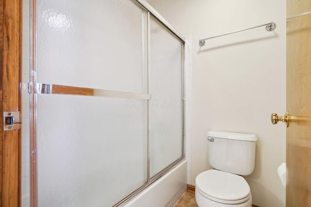 5955 Glen Village Dr, Dublin, OH 43016 - bathroom featuring bath / shower combo with glass door and toilet