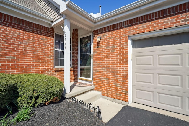 5955 Glen Village Dr, Dublin, OH 43016 - property entrance featuring brick siding and an attached garage