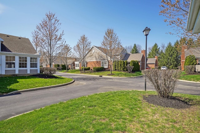 5955 Glen Village Dr, Dublin, OH 43016 - view of road with street lights, curbs, and a residential view