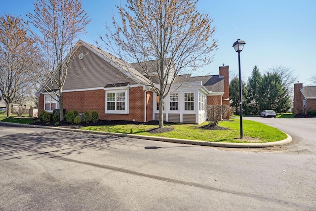 5955 Glen Village Dr, Dublin, OH 43016 - view of side of home with brick siding