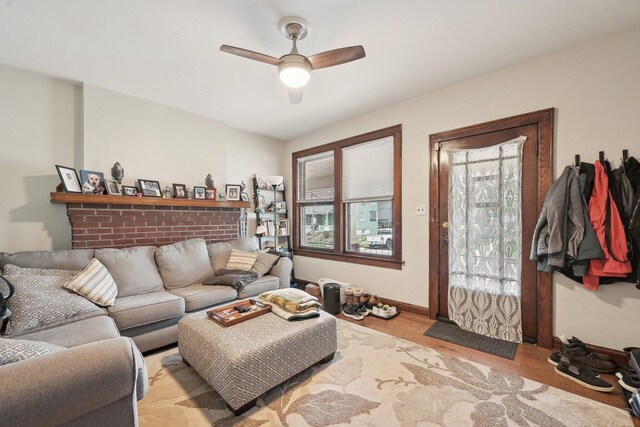 1287 City Park Ave, Columbus, OH 43206 - living room featuring ceiling fan, light wood-style floors, and baseboards