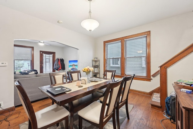 1287 City Park Ave, Columbus, OH 43206 - dining room with arched walkways, hardwood / wood-style flooring, and baseboards