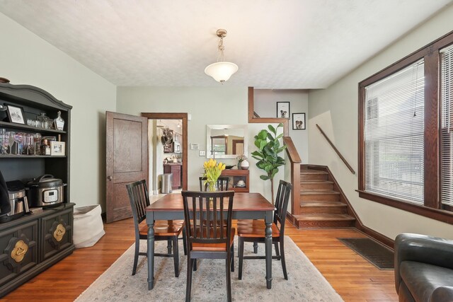 1287 City Park Ave, Columbus, OH 43206 - dining space featuring stairs and wood finished floors