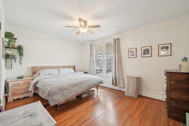 1287 City Park Ave, Columbus, OH 43206 - bedroom with wood-type flooring, baseboards, and a ceiling fan