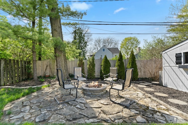 view of patio / terrace featuring a fire pit and a fenced backyard