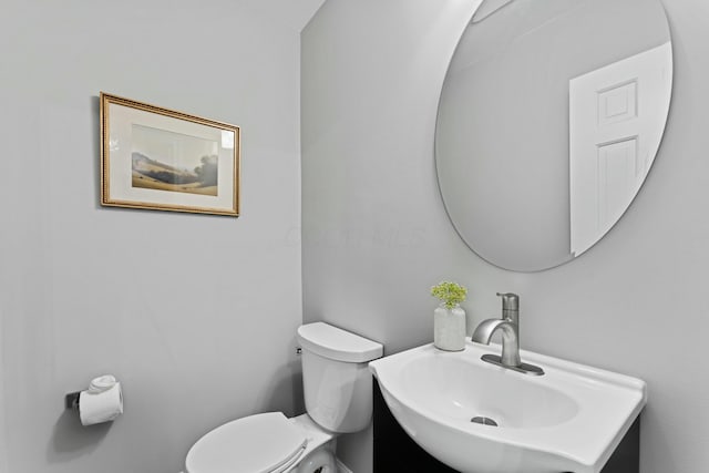 half bath with toilet and a sink