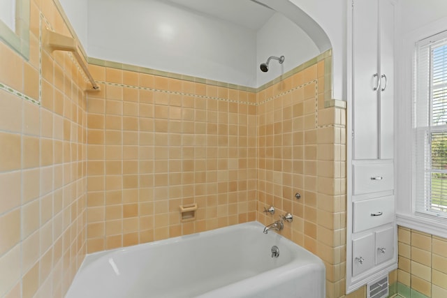 bathroom with bathtub / shower combination and visible vents