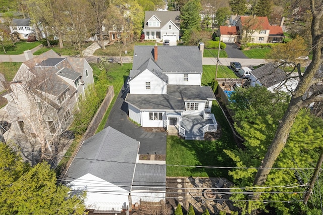 birds eye view of property with a residential view