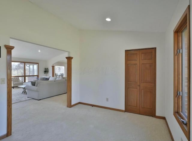 4070 Tradersville Brighton Rd, London, OH 43140 - unfurnished living room with arched walkways, baseboards, recessed lighting, and carpet flooring