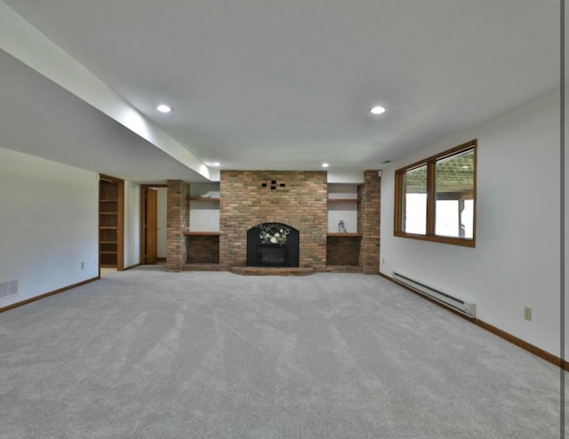 4070 Tradersville Brighton Rd, London, OH 43140 - unfurnished living room featuring a baseboard heating unit, baseboards, a brick fireplace, and recessed lighting