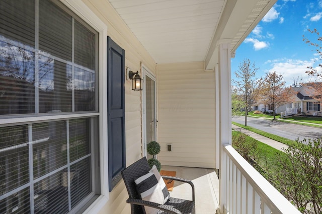 balcony with a residential view and covered porch