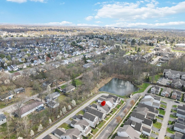 drone / aerial view with a water view and a residential view