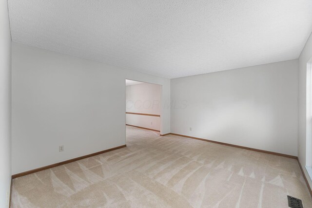 5516 Latrobe St, Westerville, OH 43081 - carpeted spare room with a textured ceiling and baseboards
