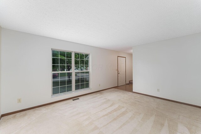 5516 Latrobe St, Westerville, OH 43081 - carpeted spare room with baseboards and a textured ceiling