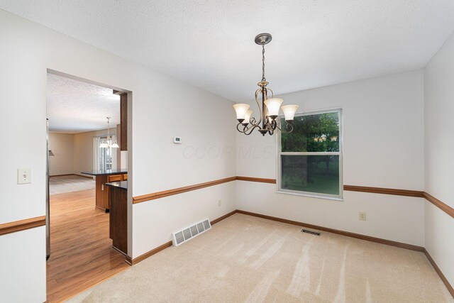 5516 Latrobe St, Westerville, OH 43081 - carpeted empty room with a chandelier, plenty of natural light, and baseboards