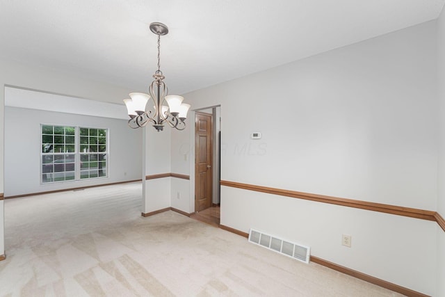 5516 Latrobe St, Westerville, OH 43081 - spare room featuring a chandelier, carpet, and baseboards