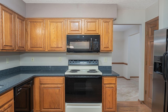 5516 Latrobe St, Westerville, OH 43081 - kitchen featuring black appliances, brown cabinetry, a textured ceiling, and carpet floors