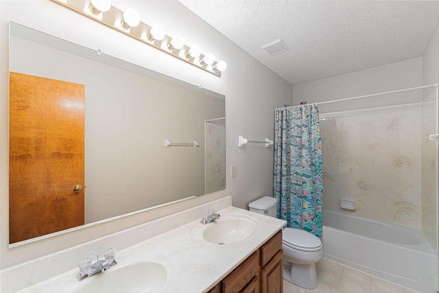 5516 Latrobe St, Westerville, OH 43081 - full bath featuring toilet, shower / tub combo with curtain, double vanity, a textured ceiling, and tile patterned flooring